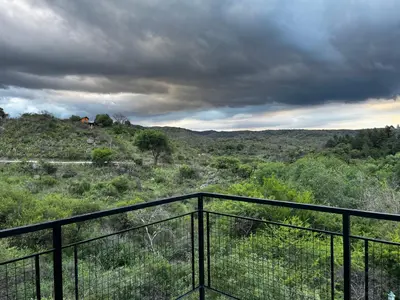 a view from the balcony of a house on a hill at Brisas Serranas in Villa Icho Cruz