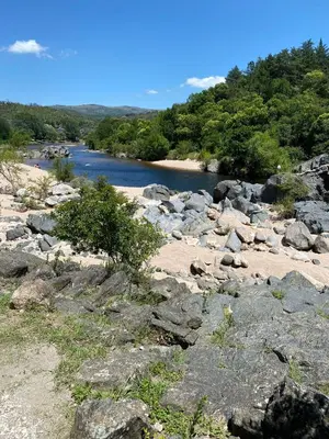 a large group of rocks and a river at Brisas Serranas in Villa Icho Cruz