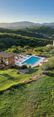 an overhead view of a swimming pool in a field at Ventura 1 in Villa Carlos Paz