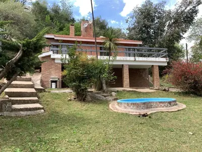 a house with a swimming pool in front of it at La Morada de sus Sueños II in San Roque