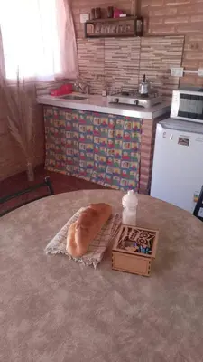a loaf of bread sitting on a table in a kitchen at Cabañas doña chiche in San Lorenzo
