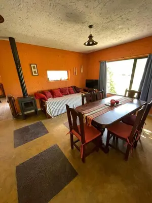 a living room with a table and a couch at Finca La Hermosa in San Javier