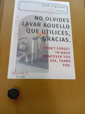 a sign on a door with a sign on it at Alquimia Dos in Cordoba