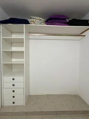 a white closet with a bunk bed in it at Posada Don Ramón in Estancia Vieja