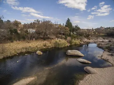 a river with some rocks in the water at Posada Don Ramón in Estancia Vieja