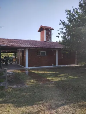 a brick house with a tower on top of it at Pao Pei in Santa Rosa de Calamuchita