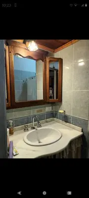 a bathroom with a sink and a mirror at Pao Pei in Santa Rosa de Calamuchita