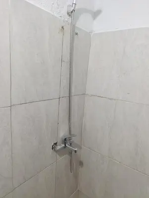 a shower in a bathroom with a faucet at Cabrales in Cordoba