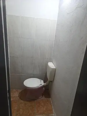 a small bathroom with a toilet in a stall at Cabrales in Cordoba