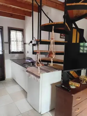 a kitchen with a counter top and a counter top at Alpinas El Chusmo 3 in Villa Ciudad Parque