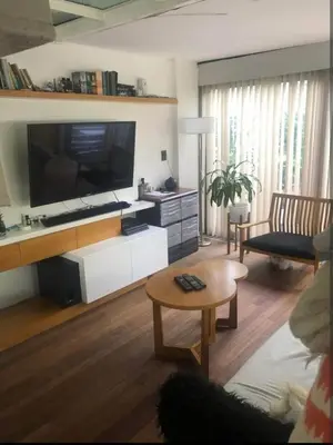 a living room with a large flat screen tv at Dto lujoso in Cordoba