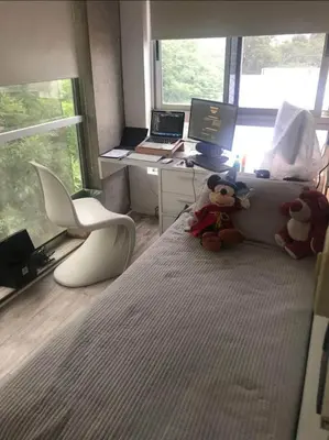 two teddy bears sitting on a bed in a bedroom at Dto lujoso in Cordoba