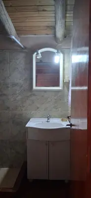 a bathroom with a sink and a mirror at El rancho de cristina y victor in Arroyo de Los Patos