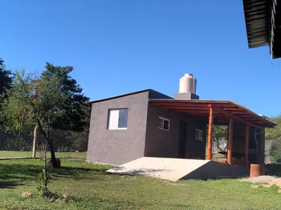 a small building with a chimney on top of it at Cabaña Don Americo in Villa García