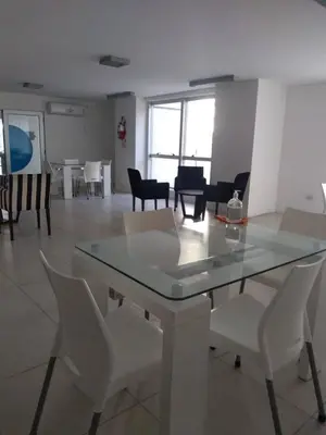 a dining room with a glass table and chairs at Apartment Nueva Córdoba in Cordoba