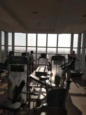 a gym with lots of cardio equipment in a building at Apartment Nueva Córdoba in Cordoba