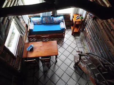 an overhead view of a living room with a couch and a table at Cabañas Fénix de Los Reartes in Los Reartes