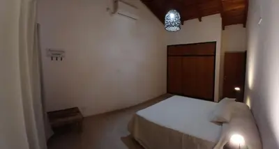 a small bedroom with a bed and a light at Alojamiento ideal en zona norte de Córdoba Capital in Cordoba