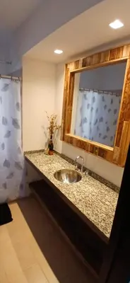 a bathroom counter with a sink and a mirror at Alojamiento ideal en zona norte de Córdoba Capital in Cordoba