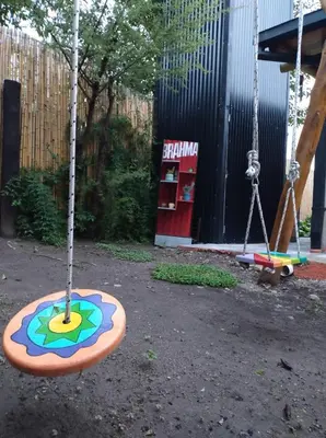 a swing yard with two swings in a playground at La Casa De Mi Viejo in San Javier