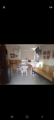 a living room with a couch and a table at Dpto 22 in Villa Carlos Paz