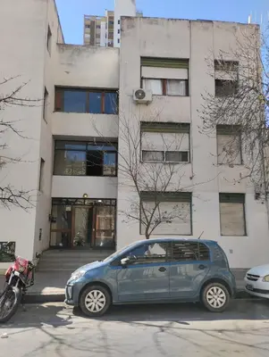 a blue car parked in front of a building at Great Lofty in Cordoba
