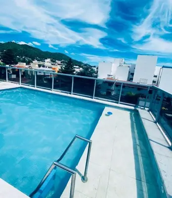 a swimming pool on the roof of a building at Departamento Centrico Eutico in Villa Carlos Paz