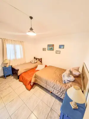 a bedroom with two beds in a room at Casa Ramona in Embalse