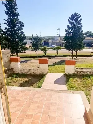 a brick walkway with trees in the background at Casa Ramona in Embalse