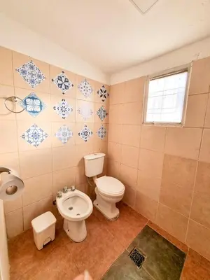 a bathroom with a toilet and a bidet at Casa Ramona in Embalse