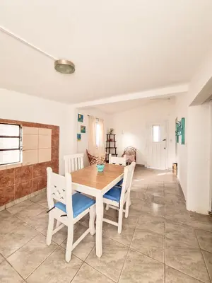 a dining room with a table and chairs at Casa Ramona in Embalse