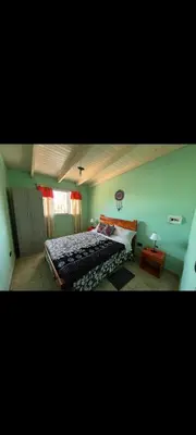 a bedroom with a large bed in a room at Villa Dolores - Departamento