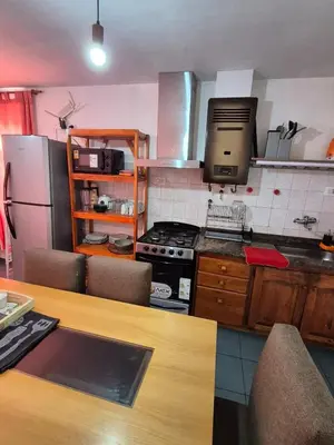 a kitchen with a stove and a counter top at Dpto Cordoba in Cordoba
