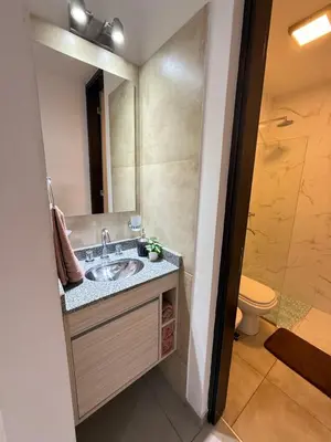 a bathroom with a sink and a toilet at Departamento premium con amplio patio en pleno centro de Carlos Paz in Villa Carlos Paz