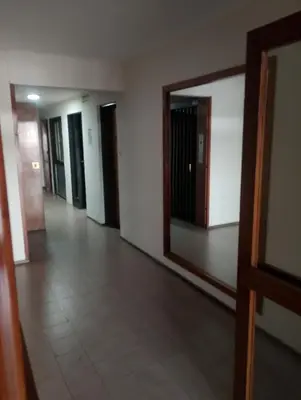 an empty hallway with a mirror in a building at I rent an apartment in the center of Cordoba Capital in Cordoba