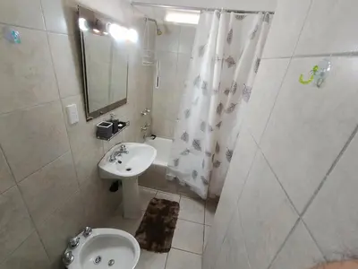 a bathroom with a sink and a toilet and a shower at I rent an apartment in the center of Cordoba Capital in Cordoba