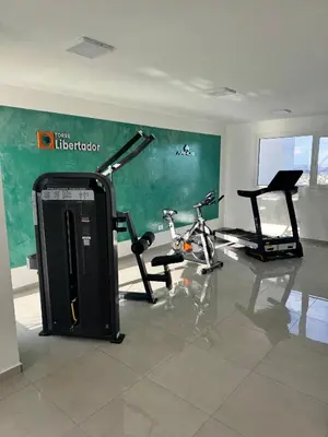 a gym with two exercise bikes in a room at departamento en edificio torre libertador in Río Tercero