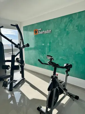 a gym with two exercise bikes in a room at departamento en edificio torre libertador in Río Tercero