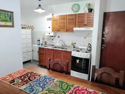 a kitchen with a sink and a stove at Departamento en zona centro La Cañada para 2 personas in Cordoba