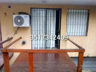 a door of a building with a fence and a speaker at Alojamiento en Carlos Paz in Villa Carlos Paz