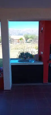 a kitchen with a sink and a large window at Hospedaje Miraflor in Cerro de Oro