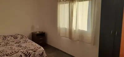 a bedroom with a bed and a window at Hospedaje Miraflor in Cerro de Oro