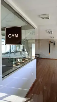 an office with a sign on a glass wall at Dpto Premium Costanera Pileta y Cochera in Villa Carlos Paz