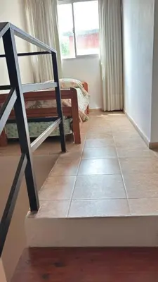 a stairway in a room with a stair case at Departamento Carlos Paz cerca Centro y Río in Villa Carlos Paz