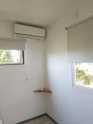 a room with a air conditioner and a window at Tiny House Potrero Cba in Potrero de Garay