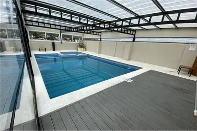 a large swimming pool in a building at Departamento Céntrico Miralejos 3 in Villa Carlos Paz