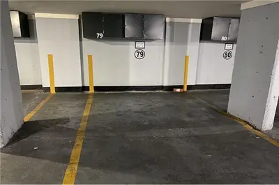an empty parking lot in a parking garage at Departamento Céntrico Miralejos 3 in Villa Carlos Paz