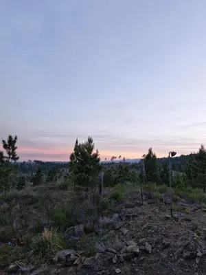 a view from the top of a hill at sunset at Brisas de la Cayana Cabaña Villa Alpina in Villa Alpina