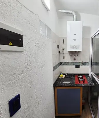 a small kitchen with a counter and a sink at Lusanyun in Villa Carlos Paz
