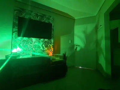 a living room with a flat screen tv on a wall at Terra Zion in Cordoba